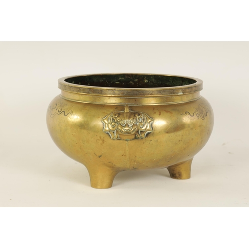 167 - AN OVERSIZED 18TH/19TH CENTURY CHINESE CAST BRONZE CENSER with inlaid decoration and foo dog mask si... 