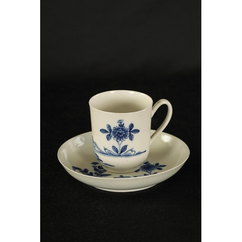 17 - AN 18TH CENTURY WORCESTER TYPE BLUE AND WHITE TEA CUP AND SAUCER with Oriental garden decoration. (1... 