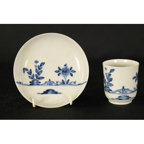 17 - AN 18TH CENTURY WORCESTER TYPE BLUE AND WHITE TEA CUP AND SAUCER with Oriental garden decoration. (1... 