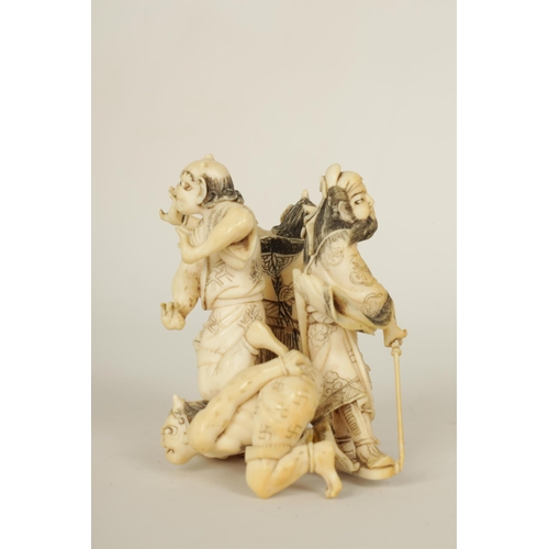 172 - A JAPANESE MEIJI PERIOD CARVED IVORY SCULPTURE depicting three guardians and a samurai. (6cm high )