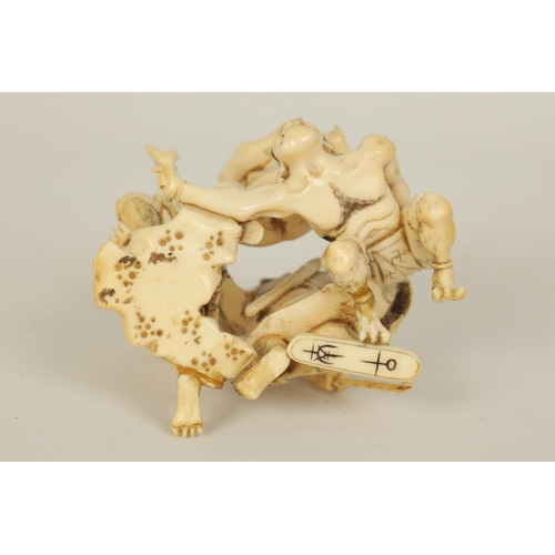 172 - A JAPANESE MEIJI PERIOD CARVED IVORY SCULPTURE depicting three guardians and a samurai. (6cm high )