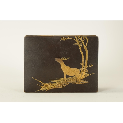 173 - A JAPANESE MEIJI PERIOD GILT METAL IRON WORK BOX decorated with a stag under trees to the lid, the s... 