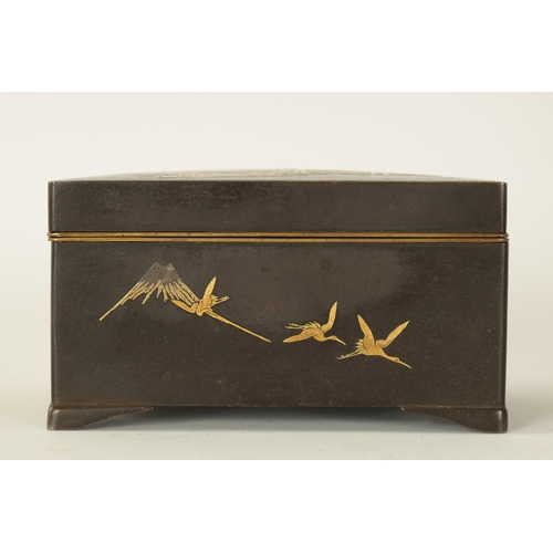 173 - A JAPANESE MEIJI PERIOD GILT METAL IRON WORK BOX decorated with a stag under trees to the lid, the s... 