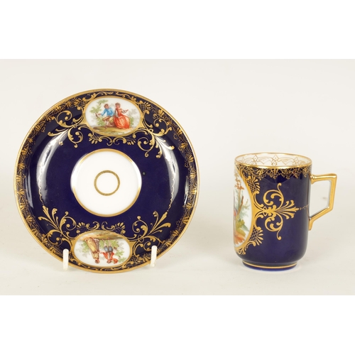 18 - A LATE 19TH CENTURY VIENNA STYLE SCROLLED GILT AND ROYAL BLUE CABINET CUP AND SAUCER the cylindrical... 