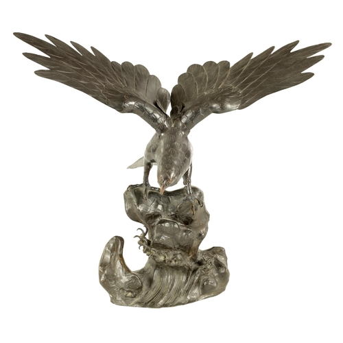 181 - A 19TH CENTURY CHINESE PATINATED BRONZE SCULPTURE OF AN EAGLE perched on a naturalistic stumpwork ba... 