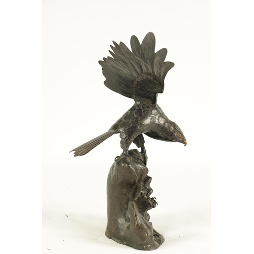 181 - A 19TH CENTURY CHINESE PATINATED BRONZE SCULPTURE OF AN EAGLE perched on a naturalistic stumpwork ba... 