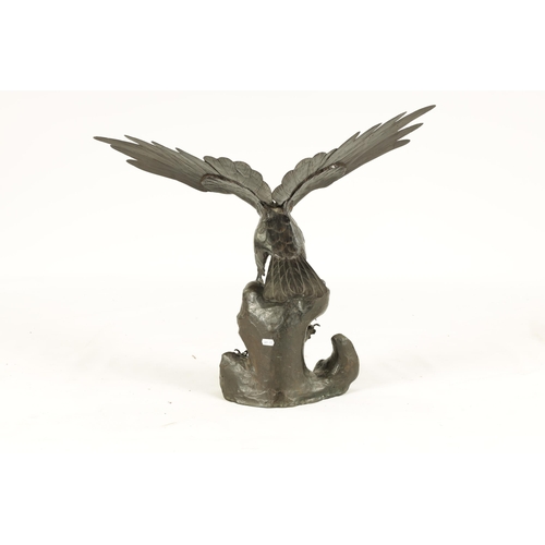 181 - A 19TH CENTURY CHINESE PATINATED BRONZE SCULPTURE OF AN EAGLE perched on a naturalistic stumpwork ba... 