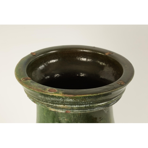 182 - A CHINESE HAN DYNASTY GREEN GLAZED POTTERY HU VASE with masked side mounts and ringed decoration - s... 