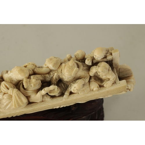 183 - A FINE 19TH CENTURY CARVED IVORY CHINESE SCULPTURE depicting figures on a boat finely carved with dr... 