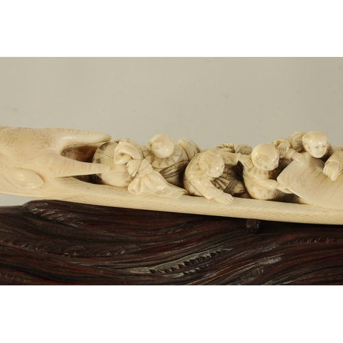 183 - A FINE 19TH CENTURY CARVED IVORY CHINESE SCULPTURE depicting figures on a boat finely carved with dr... 