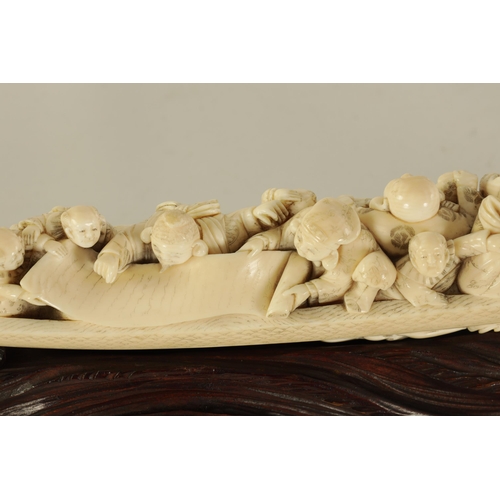 183 - A FINE 19TH CENTURY CARVED IVORY CHINESE SCULPTURE depicting figures on a boat finely carved with dr... 