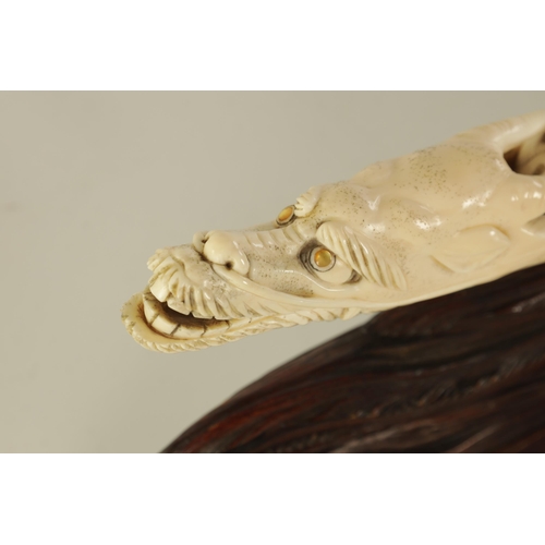 183 - A FINE 19TH CENTURY CARVED IVORY CHINESE SCULPTURE depicting figures on a boat finely carved with dr... 