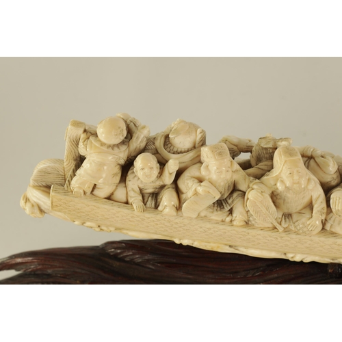 183 - A FINE 19TH CENTURY CARVED IVORY CHINESE SCULPTURE depicting figures on a boat finely carved with dr... 