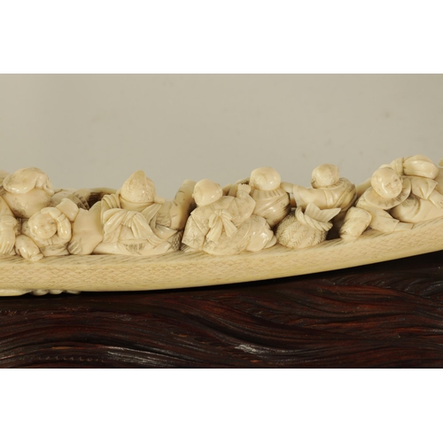 183 - A FINE 19TH CENTURY CARVED IVORY CHINESE SCULPTURE depicting figures on a boat finely carved with dr... 