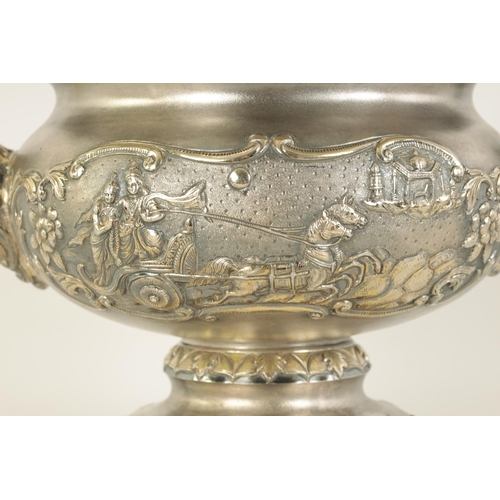 184 - A FINE 19TH CENTURY INDIAN SILVER BOWL of scalloped pedestal form with gilt interior and embossed fi... 