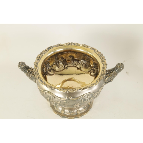 184 - A FINE 19TH CENTURY INDIAN SILVER BOWL of scalloped pedestal form with gilt interior and embossed fi... 