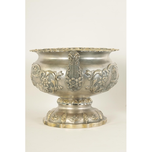 184 - A FINE 19TH CENTURY INDIAN SILVER BOWL of scalloped pedestal form with gilt interior and embossed fi... 