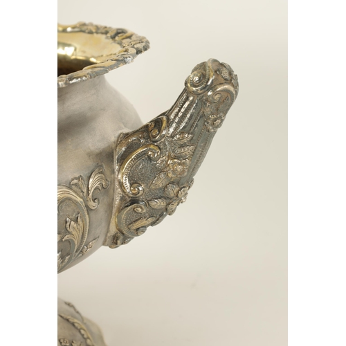 184 - A FINE 19TH CENTURY INDIAN SILVER BOWL of scalloped pedestal form with gilt interior and embossed fi... 