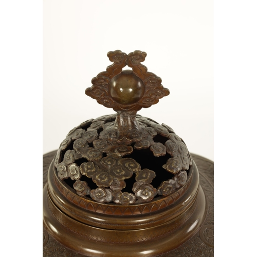 185 - A GOOD JAPANESE MEIJI PERIOD PATINATED BRONZE CENSER decorated with high relief triple panels of wat... 