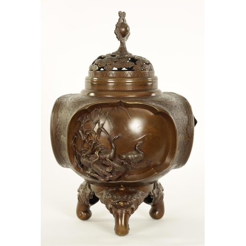 185 - A GOOD JAPANESE MEIJI PERIOD PATINATED BRONZE CENSER decorated with high relief triple panels of wat... 