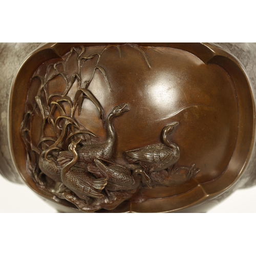 185 - A GOOD JAPANESE MEIJI PERIOD PATINATED BRONZE CENSER decorated with high relief triple panels of wat... 