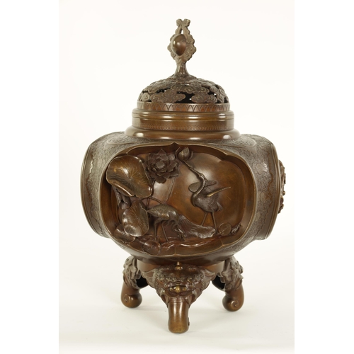 185 - A GOOD JAPANESE MEIJI PERIOD PATINATED BRONZE CENSER decorated with high relief triple panels of wat... 