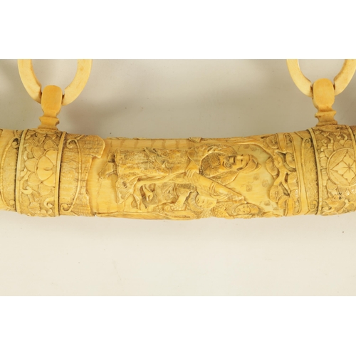 186 - A JAPANESE MEIJI PERIOD CARVED SEGMENTED IVORY SAMURAI SWORD finely carved with reliefwork scenes of... 