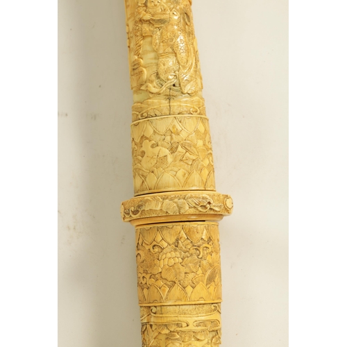 186 - A JAPANESE MEIJI PERIOD CARVED SEGMENTED IVORY SAMURAI SWORD finely carved with reliefwork scenes of... 