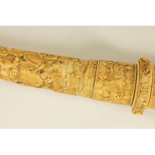 186 - A JAPANESE MEIJI PERIOD CARVED SEGMENTED IVORY SAMURAI SWORD finely carved with reliefwork scenes of... 