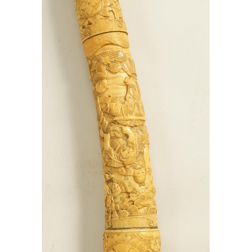 186 - A JAPANESE MEIJI PERIOD CARVED SEGMENTED IVORY SAMURAI SWORD finely carved with reliefwork scenes of... 