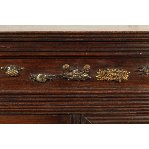 190 - A JAPANESE MEIJI PERIOD STAINED WOOD COLLECTOR'S CABINET fitted with gilt bronze menuki, comprising ... 