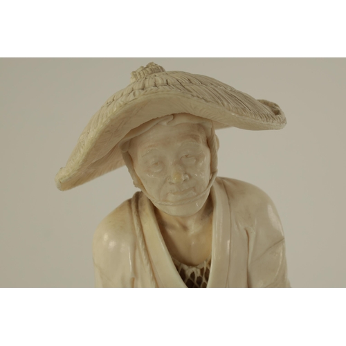 193 - A LARGE JAPANESE MEIJI PERIOD CARVED IVORY FIGURE depiciting a farmer wearing a hat sewing seeds. (2... 