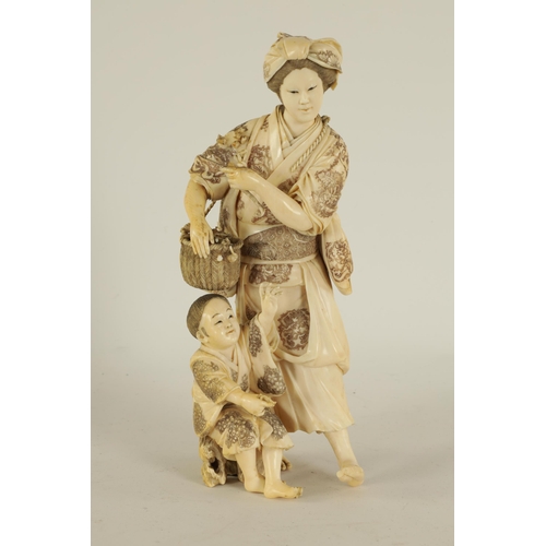 194 - A LARGE JAPANESE MEIJI PERIOD CARVED IVORY FIGURE GROUP depicting a flower seller with child - signe... 