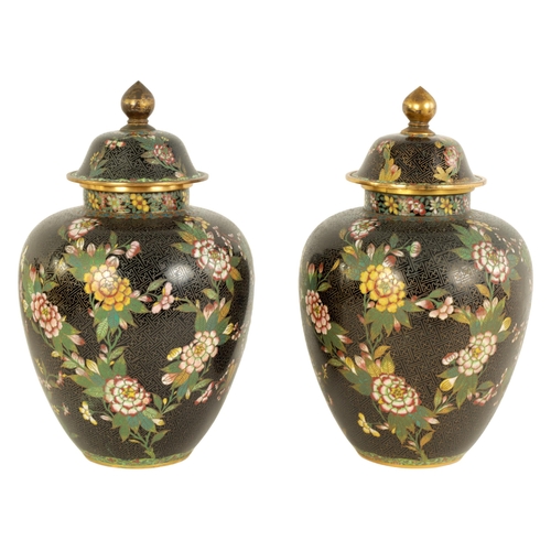 197 - A PAIR OF 19TH CENTURY CHINESE CLOISONNÉ LIDDED VASES of tapering shouldered form decorated with lea... 