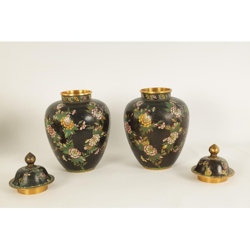 197 - A PAIR OF 19TH CENTURY CHINESE CLOISONNÉ LIDDED VASES of tapering shouldered form decorated with lea... 