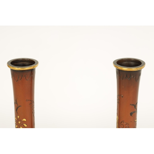 198 - A PAIR OF JAPANESE MEIJI PERIOD MIXED METAL INLAID BRONZE VASES decorated with sprays of flowers and... 