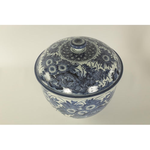 199 - AN 18TH CENTURY JAPANESE LARGE BLUE AND WHITE PORCELAIN LIDDED BOWL of rounded footed form decorated... 