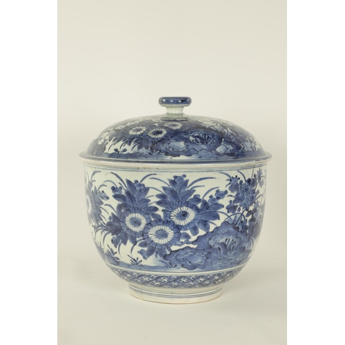 199 - AN 18TH CENTURY JAPANESE LARGE BLUE AND WHITE PORCELAIN LIDDED BOWL of rounded footed form decorated... 