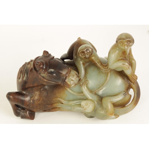 200 - AN EARLY CHINESE CARVED RUSSET JADE SCULPTURE OF A RECUMBENT HORSE AND THREE MONKEYS finely carved a... 