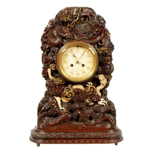 202 - A MEIJI PERIOD JAPANESE HARDWOOD, IVORY AND LACQUERWORK TABLE CLOCK the finely carved case decorated... 