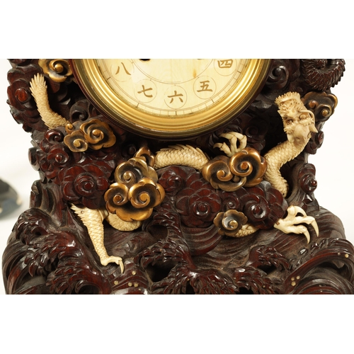 202 - A MEIJI PERIOD JAPANESE HARDWOOD, IVORY AND LACQUERWORK TABLE CLOCK the finely carved case decorated... 