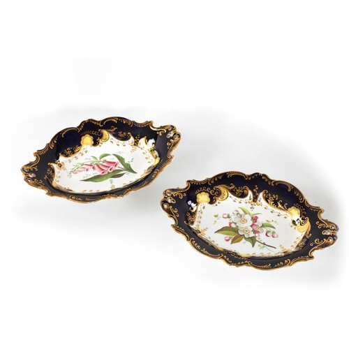 26 - A PAIR OF EARLY 19TH CENTURY SPODE TYPE DESSERT DISHES of pierced two-handled scalloped oval form wi... 