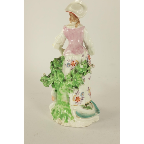 27 - AN 18TH CENTURY DERBY FIGURE OF A SHEPHERDESS finely decorated and embellished with floral sprays, o... 