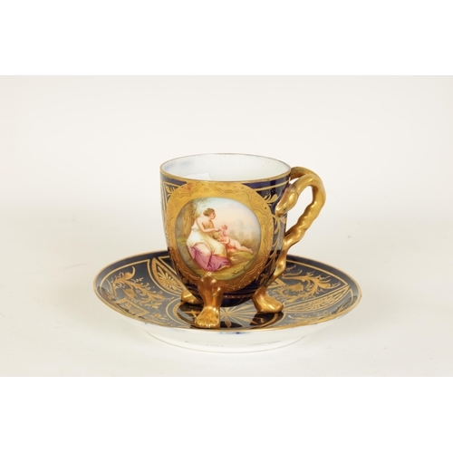 28 - A LATE 19TH CENTURY VIENNA STYLE RICHLY GILT AND ROYAL BLUE CABINET CUP AND SAUCER the ovoid cup wit... 