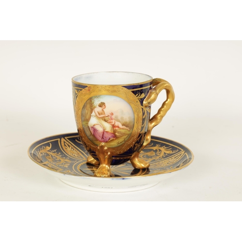 28 - A LATE 19TH CENTURY VIENNA STYLE RICHLY GILT AND ROYAL BLUE CABINET CUP AND SAUCER the ovoid cup wit... 