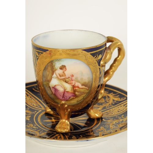 28 - A LATE 19TH CENTURY VIENNA STYLE RICHLY GILT AND ROYAL BLUE CABINET CUP AND SAUCER the ovoid cup wit... 