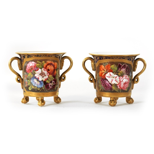 36 - A PAIR OF EARLY 19TH CENTURY DUESBURY DERBY TWO-HANDLED CUPS RAISED ON CLAW AND BALL FEET Royal Blue... 