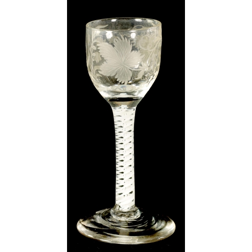 4 - A GEORGIAN WINE GLASS the rounded bowl engraved with a fruiting vinework and flower head spray on a ... 