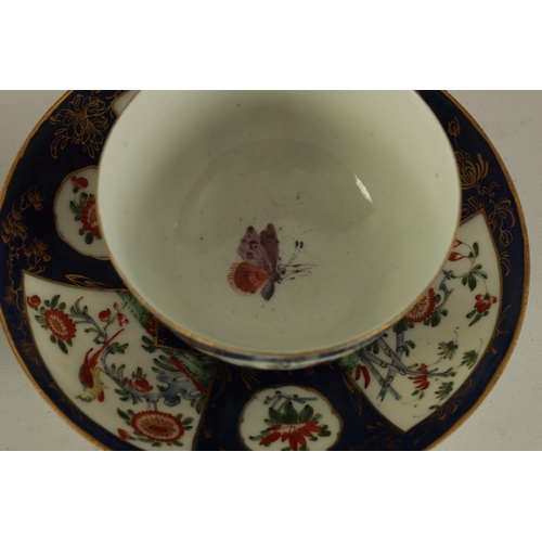 42 - AN 18TH CENTURY FIRST PERIOD WORCESTER TYPE TEA BOWL AND SAUCER blue ground with delicate floral dec... 