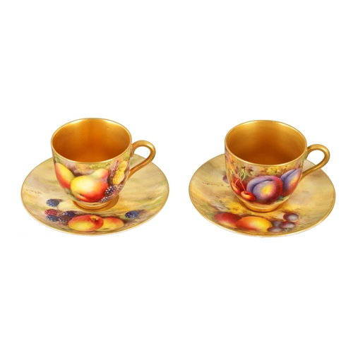 45 - TWO ROYAL WORCESTER FRUIT CABINET CUPS AND SAUCERS each richly gilt and painted with ripe fruits on ... 